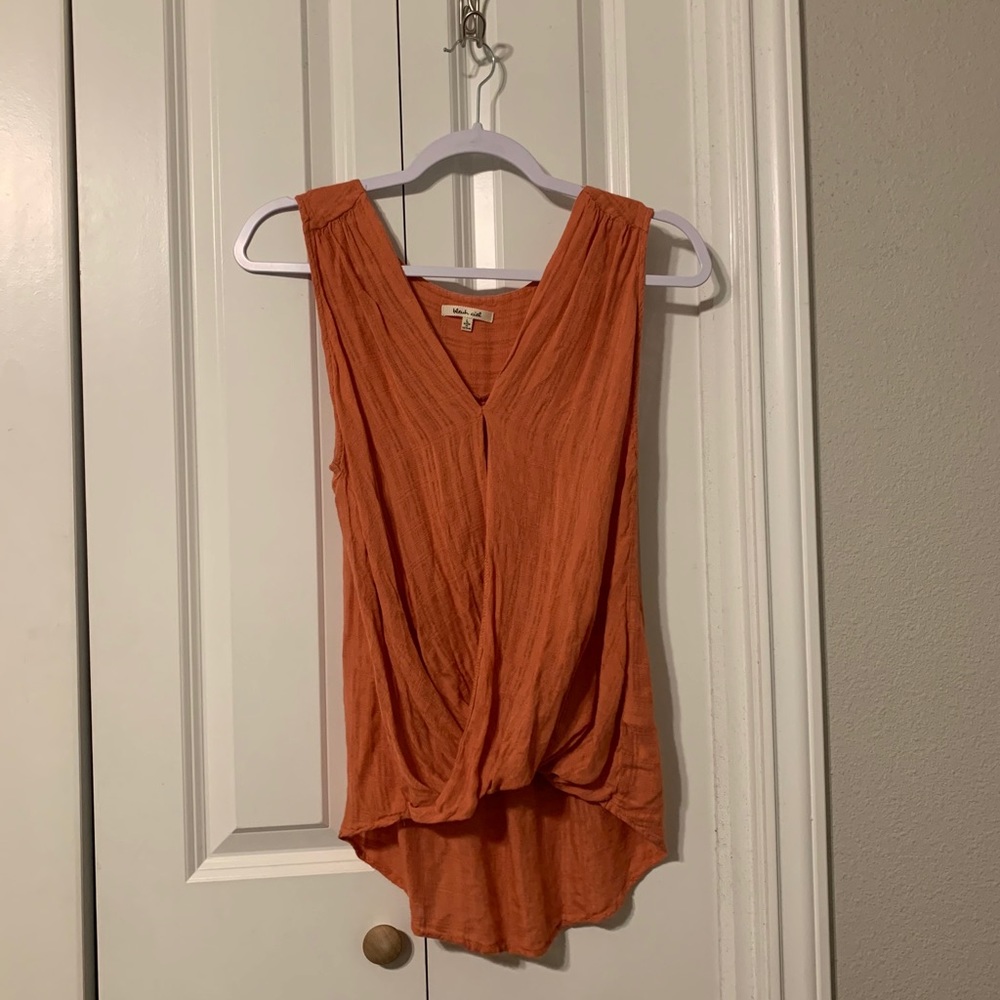 Orange sleeveless blouse
